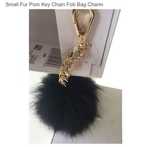 Black Micheal Kors small fur Pom